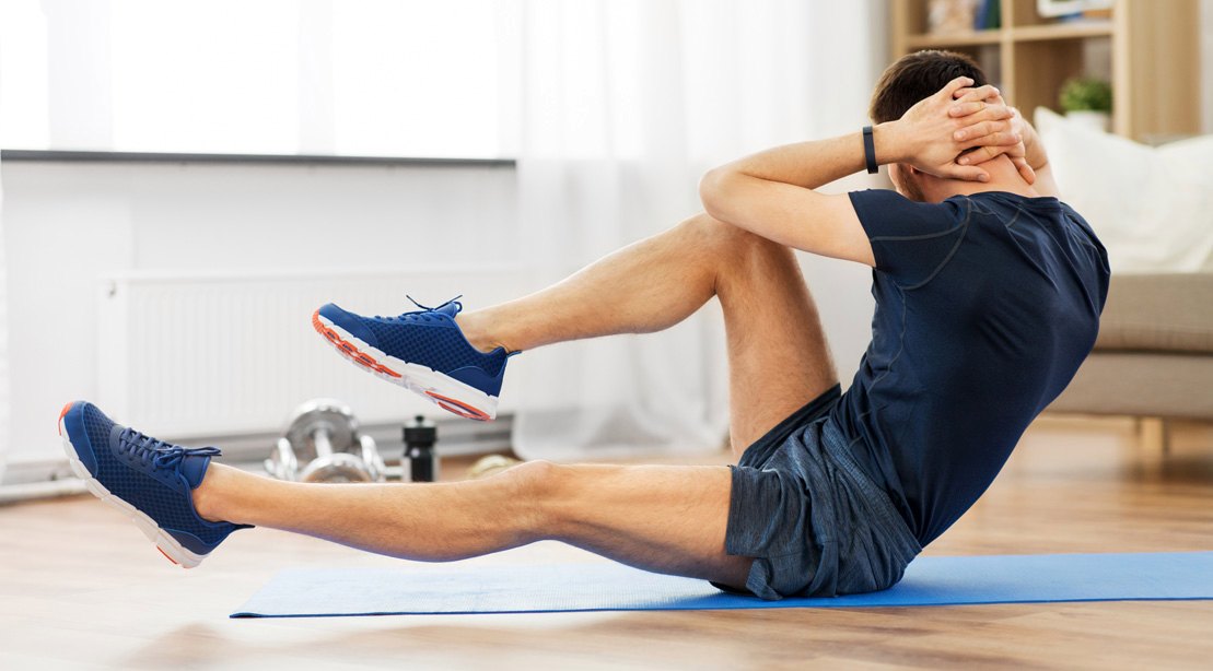 Man Doing Crunches At Home